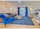 Bright and airy living room boasts large window, comfortable seating, and stylish décor at 3192 Pinetree St, Port Charlotte, FL 33952