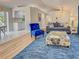 Open concept living room with kitchen views, hardwood flooring, and modern furniture at 3192 Pinetree St, Port Charlotte, FL 33952