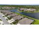 Stunning aerial view of homes lining a lake in a well-manicured residential neighborhood at 3419 Lakewood Blvd, North Port, FL 34287