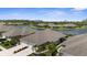 Aerial view captures a residential neighborhood with houses nestled near a scenic lake at 3419 Lakewood Blvd, North Port, FL 34287