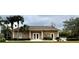 Charming community clubhouse featuring well-maintained landscaping and a welcoming entrance at 3419 Lakewood Blvd, North Port, FL 34287
