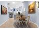 Inviting dining area with a round table, views into kitchen, and stylish decor at 3419 Lakewood Blvd, North Port, FL 34287