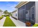 Welcoming screened entry featuring a wreath, pretty flower pot, and a well-manicured walkway at 3419 Lakewood Blvd, North Port, FL 34287
