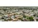 Wide aerial view of a residential neighborhood featuring cozy homes and lush landscaping at 379 Peppertree Rd, Venice, FL 34293