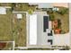 Bird's eye view showing the home's layout, roof with solar panels, and outdoor shed at 379 Peppertree Rd, Venice, FL 34293