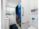 White bathroom features a shower with fish-themed curtains, and updated fixtures at 379 Peppertree Rd, Venice, FL 34293