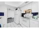 Bright and functional kitchen offers white appliances and adjacent dining area for easy access at 379 Peppertree Rd, Venice, FL 34293