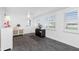 Bright, open living space features tile floors and natural light from window and door with shutter blinds at 379 Peppertree Rd, Venice, FL 34293