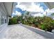 Relaxing outdoor patio perfect for entertaining with serene garden views and beautiful lush landscaping at 379 Peppertree Rd, Venice, FL 34293