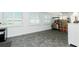 Versatile room with light walls, tiled floors, and shuttered windows, great for flex space and storage at 379 Peppertree Rd, Venice, FL 34293