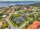 Aerial view of a canal with multiple boat docks and boats at 403 Picasso Dr, Nokomis, FL 34275