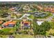 Aerial view of a house featuring a screened pool and putting green at 403 Picasso Dr, Nokomis, FL 34275