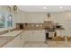 Bright kitchen with updated appliances, ample counter space, and white cabinets at 403 Picasso Dr, Nokomis, FL 34275