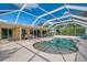 Beautiful screened-in pool area with a spacious deck, ideal for outdoor entertaining at 403 Picasso Dr, Nokomis, FL 34275