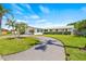 Charming single-story home featuring a circular driveway and well-manicured landscaping at 4255 13Th Ne Ln, St Petersburg, FL 33703