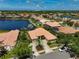 Expansive aerial view showcases the property's prime location with a serene lake backdrop at 4321 Via Del Santi Dr, Venice, FL 34293