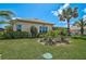Well-manicured backyard and landscaping on a sunny day with thriving green lawn at 4321 Via Del Santi Dr, Venice, FL 34293
