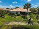 Aerial view of a charming home boasting well-manicured backyard and mature landscaping at 4321 Via Del Santi Dr, Venice, FL 34293