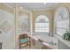 Bright bathroom featuring a tub under window, separate shower, and decorative chair at 4321 Via Del Santi Dr, Venice, FL 34293