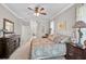 Bright main bedroom with large windows, comfortable furnishings, and stylish décor at 4321 Via Del Santi Dr, Venice, FL 34293