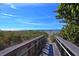 Boardwalk leading to the beach, offering easy access to the sand and ocean at 442 Sunset Lake Blvd # 104, Venice, FL 34292
