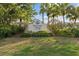 An inviting sign for Waterside Village at Venice Center, nestled among lush landscaping, marking a welcoming neighborhood entrance at 442 Sunset Lake Blvd # 104, Venice, FL 34292