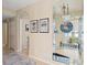 Inviting foyer with beach-themed decorations and tiled floors offer a glimpse of the coastal lifestyle at 442 Sunset Lake Blvd # 104, Venice, FL 34292