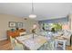 Bright and airy living room with dining area, hardwood floors and comfortable seating at 442 Sunset Lake Blvd # 104, Venice, FL 34292