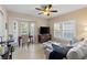 Inviting living room offers tiled floors, plantation shutters, and a comfortable seating area at 442 Sunset Lake Blvd # 104, Venice, FL 34292