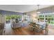 Bright and airy living room and dining area with hardwood floors and comfortable seating at 442 Sunset Lake Blvd # 104, Venice, FL 34292