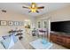 Comfortable living room with tiled floors, and a charming view of the adjacent kitchen at 442 Sunset Lake Blvd # 104, Venice, FL 34292