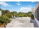 Landscaped backyard with comfortable seating and beautiful flower and shrub accents at 4531 Crystal Rd, Venice, FL 34293