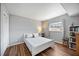 Light bedroom with sleek floors, bright window, and a clean, neutral color scheme at 4531 Crystal Rd, Venice, FL 34293