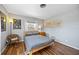 Bright bedroom boasts natural light, complemented by wood-look floors at 4531 Crystal Rd, Venice, FL 34293