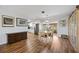 Bright dining area with hardwood floors, a wooden table, and ample natural light flowing into the kitchen at 4531 Crystal Rd, Venice, FL 34293