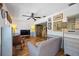 Comfortable living room with hardwood floors, a ceiling fan, and a view into the dining area at 4531 Crystal Rd, Venice, FL 34293