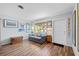 Cozy living room bathed in natural light features stylish decor and wood-look floors at 4531 Crystal Rd, Venice, FL 34293