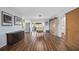 Open-concept living area with wood-look flooring, flowing from dining to living at 4531 Crystal Rd, Venice, FL 34293