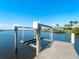 Boat lift on a dock overlooking the water at 5035 Collingswood Blvd, Port Charlotte, FL 33948