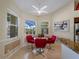 Bright dining area by the kitchen features great natural light and views of the outdoor area at 5035 Collingswood Blvd, Port Charlotte, FL 33948