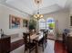 Cozy dining room featuring large windows and ample space for entertaining at 5035 Collingswood Blvd, Port Charlotte, FL 33948