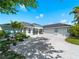 Charming single-story home featuring a 3-car garage and a well-manicured lawn at 5035 Collingswood Blvd, Port Charlotte, FL 33948