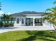 Inviting home with a spacious driveway, covered entry, and well-manicured landscaping at 5035 Collingswood Blvd, Port Charlotte, FL 33948