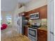 Stylish kitchen with modern appliances, granite countertops, and ample storage for culinary enthusiasts at 5035 Collingswood Blvd, Port Charlotte, FL 33948