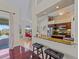 The kitchen sits in the middle ground between the dining area and bar stool seating area at 5035 Collingswood Blvd, Port Charlotte, FL 33948