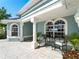 Relaxing outdoor patio with seating area, perfect for enjoying the waterfront view at 5035 Collingswood Blvd, Port Charlotte, FL 33948