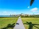 Waterfront property with a boardwalk leading to the shoreline at 5035 Collingswood Blvd, Port Charlotte, FL 33948