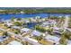 Aerial view of waterfront community featuring multiple canals and homes, with easy access to open water at 507 Buena Vista Dr, Nokomis, FL 34275