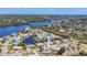 Aerial view of a waterfront home with direct access to the Gulf of Mexico at 507 Buena Vista Dr, Nokomis, FL 34275