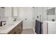 Modern bathroom with double vanity, quartz counters and glass enclosed shower at 507 Buena Vista Dr, Nokomis, FL 34275